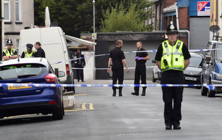 Officers stand behind police cordon after three men were arrested in connection with an explosion on the London Underground, in Newport, Wales, Britain, September 20, 2017. REUTERS/Rebecca Naden