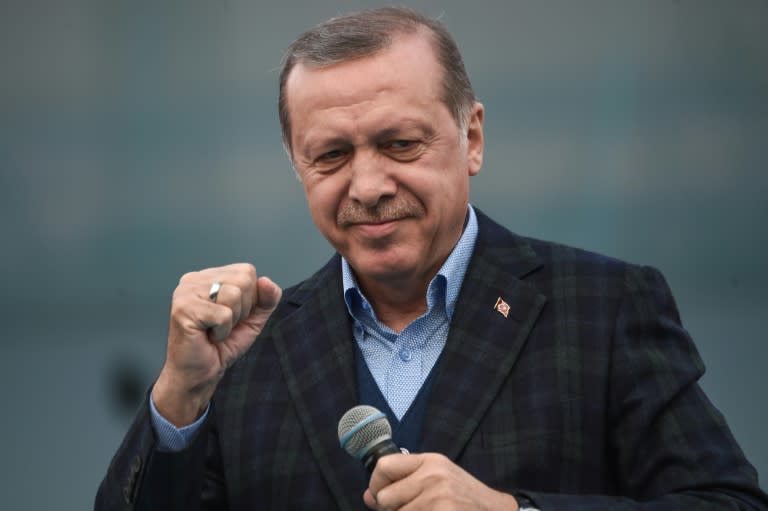 Turkish President Recep Tayyip Erdogan gestures as he delivers a speech on April 8, 2017 during a campaign rally for the "yes" vote in a constitutional referendum in Istanbul