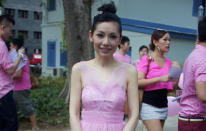 Ex-mediacorp artiste and TV personality, Sharon Au, arrives at Pink Dot in a frilly pink dress. Au is also one of Pink Dot's ambassadors for 2012, together with drag queen Kumar and actor Lim Yu-Beng. (Yahoo! photo/Melissa Law)