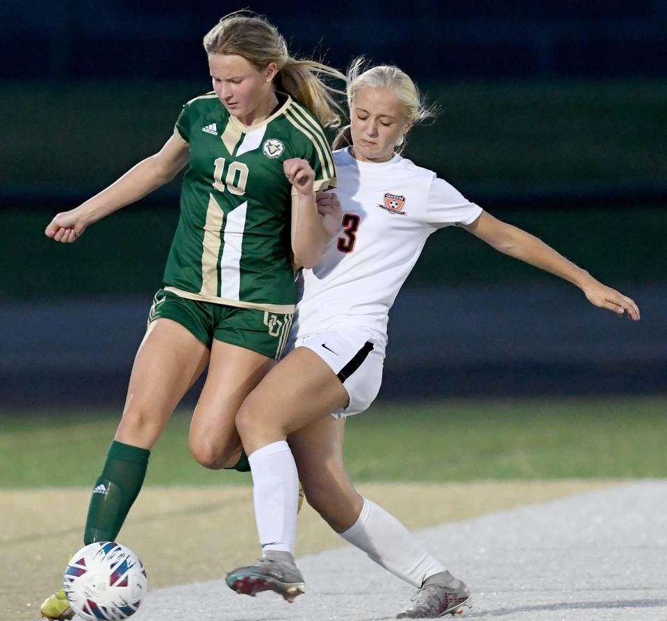 GlenOak's Katie Esporite tries to control the ball against Green's Anna Well, Wednesday, Sept 20, 2023.