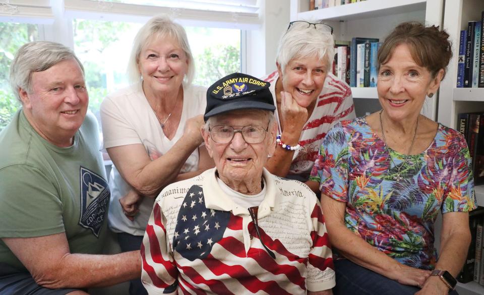 On the eve of his 103rd birthday on July 4th, World War II veteran Ed Vrona poses with son-in-law and daughter, John & Vicki Boquist, neighbor Sam Riner and Aberdeen At Ormond activities director Cindy Miller (left to right) at the Aberdeen At Ormond mobile home community in Ormond Beach.