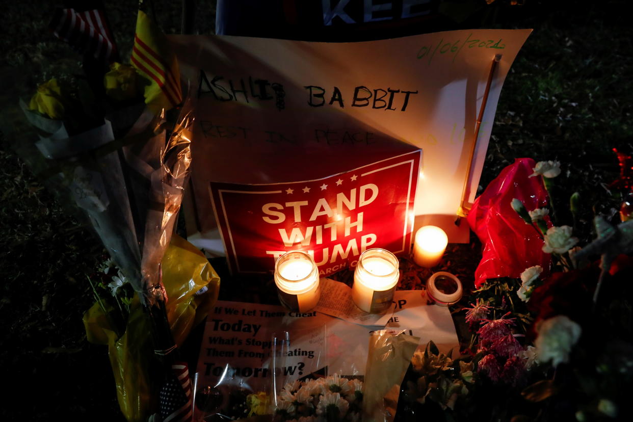 Flowers and candles are seen at a memorial for Ashli Babbitt, the woman who was shot dead at the U.S. Capitol after a mob of President Trump's supporters stormed the building on Jan. 6, 2021. (Shannon Stapleton/Reuters)