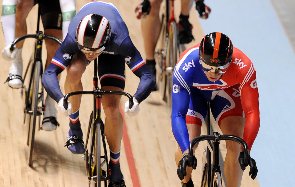 Chris Hoy of Britain (R) crosses the finish line ahead of Mickael Bourgain of France (L) to win his second round heat in the men's keirin as Scott Sunderland of Australia (L) looks on at the 2012 Track Cycling World Championships in Melbourne, on April 8, 2012.  IMAGE STRICTLY RESTRICTED TO EDITORIAL USE - STRICTLY NO COMMERCIAL USE  AFP PHOTO/William WEST (Photo credit should read WILLIAM WEST/AFP/Getty Images)