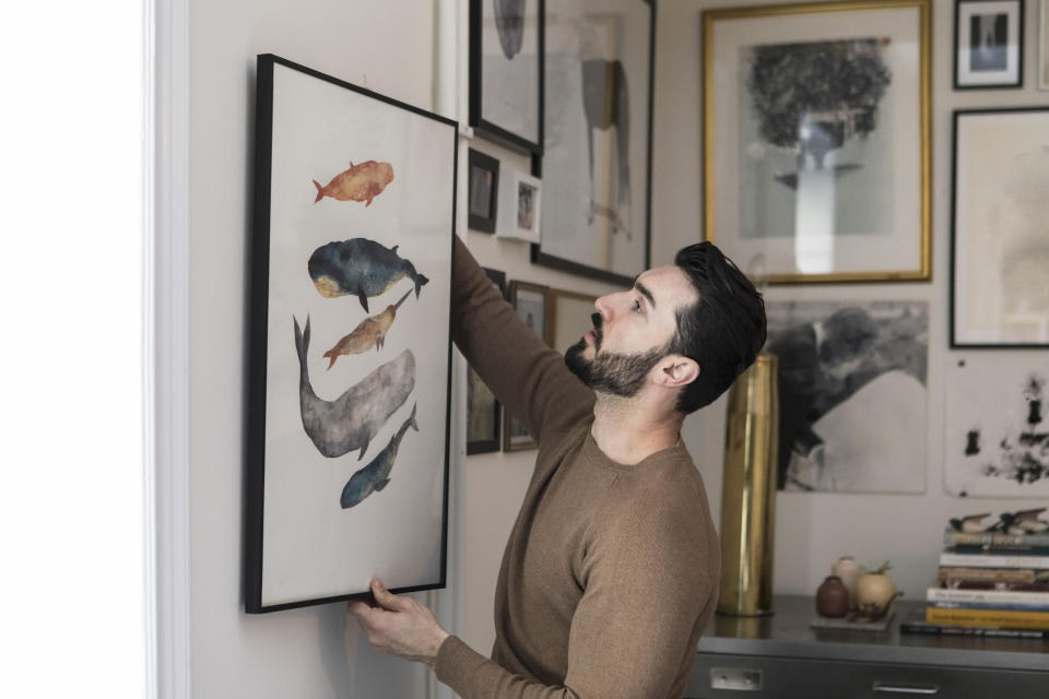 Whether you are putting your own art or photography skills to use or buying prints, adding fun slogans, paintings or graphics instantly add a bit of your personality to a room. (Getty Images)
