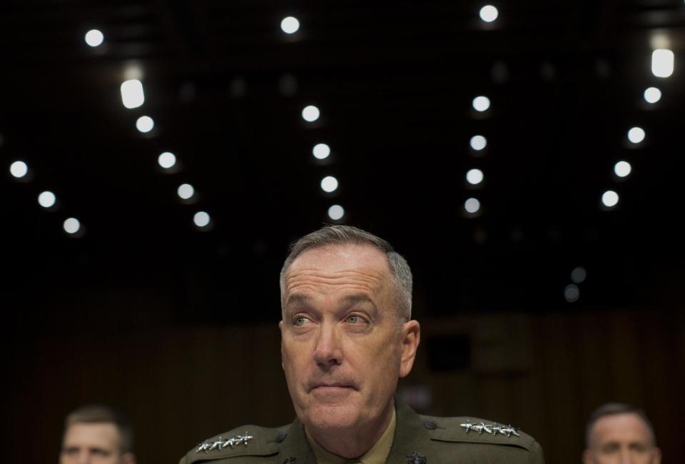 Marine Gen. Joseph F. Dunford, Jr., Commander, International Security Assistance Force, listens on Capitol Hill in Washington, Wednesday, March 12, 2014, while testifying before the Senate Armed Services Committee on the situation in Afghanistan. President Barack Obama has threatened to withdraw all American forces from Afghanistan if a new security agreement is not signed by the end of the year, but there is no legal reason the U.S. has to resort to the "zero option," as administration officials have repeatedly claimed. (AP Photo/Carolyn Kaster)