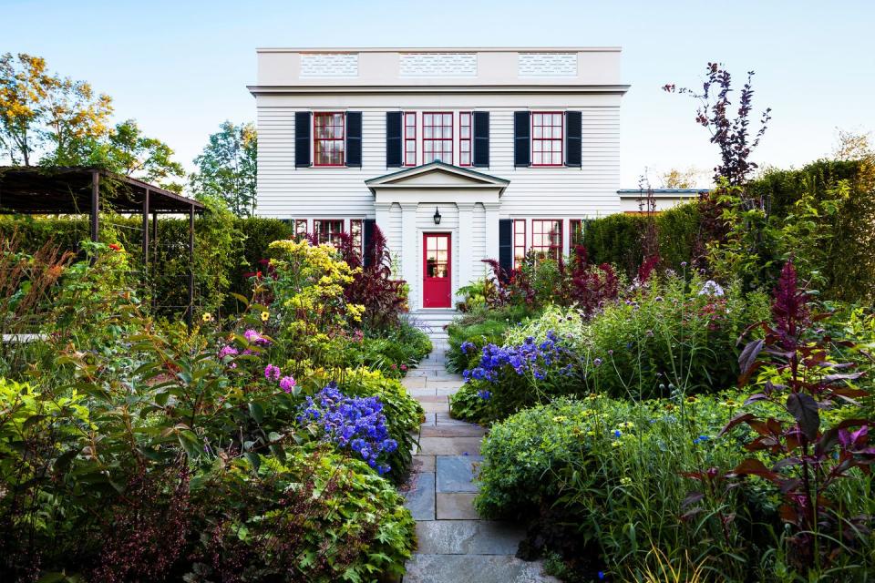 a house with a garden in front of it