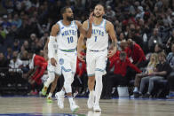 Minnesota Timberwolves guard Mike Conley (10) gestures after making a 3-point shot during the first half of an NBA basketball game against the Chicago Bulls, Sunday, March 31, 2024, in Minneapolis. (AP Photo/Abbie Parr)