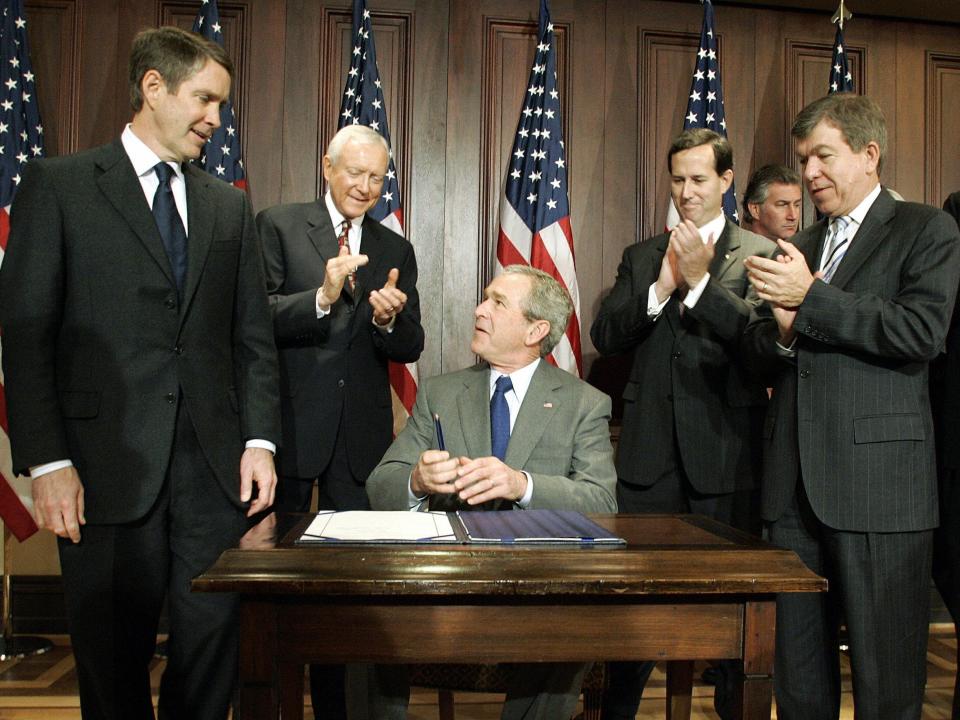 President George W. Bush is applauded for signing the Protection of Lawful Commerce Arms Act in 2005.