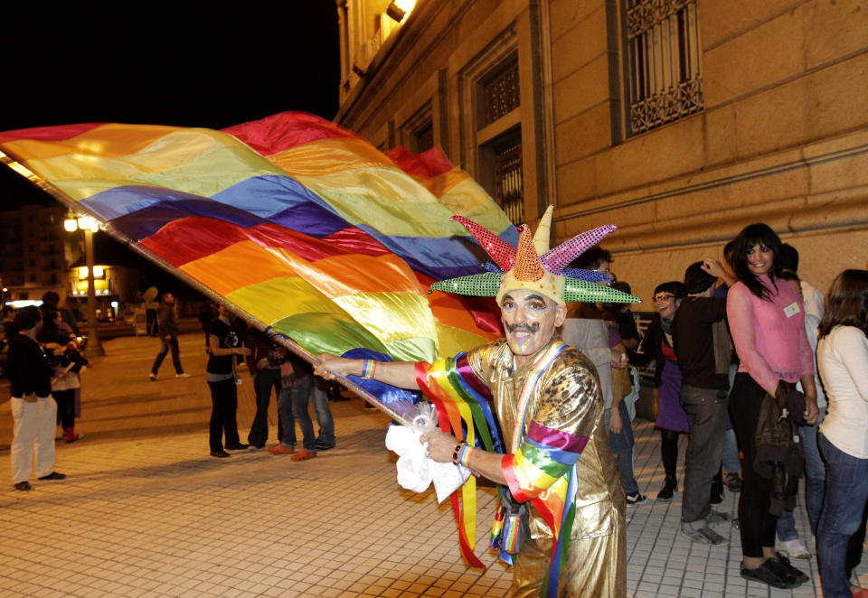 A man celebrates outside the Congress building after Uruguay's Congress passed a bill to allow same-sex marriages, making it the second country in predominantly Roman Catholic Latin America to do so April 10, 2013. Seventy-one of 92 lawmakers in the lower house of Congress voted in favor of the proposal, one week after the Senate passed it by a wide majority. Leftist President Jose Mujica, a former guerrilla fighter, is expected to sign the bill into law. REUTERS/Andres Stapff (URUGUAY)