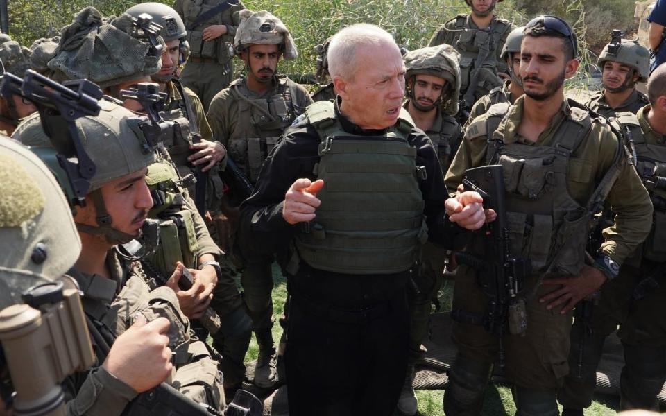 Yoav Gallant, the Israeli defence minister, with troops near the Gaza border