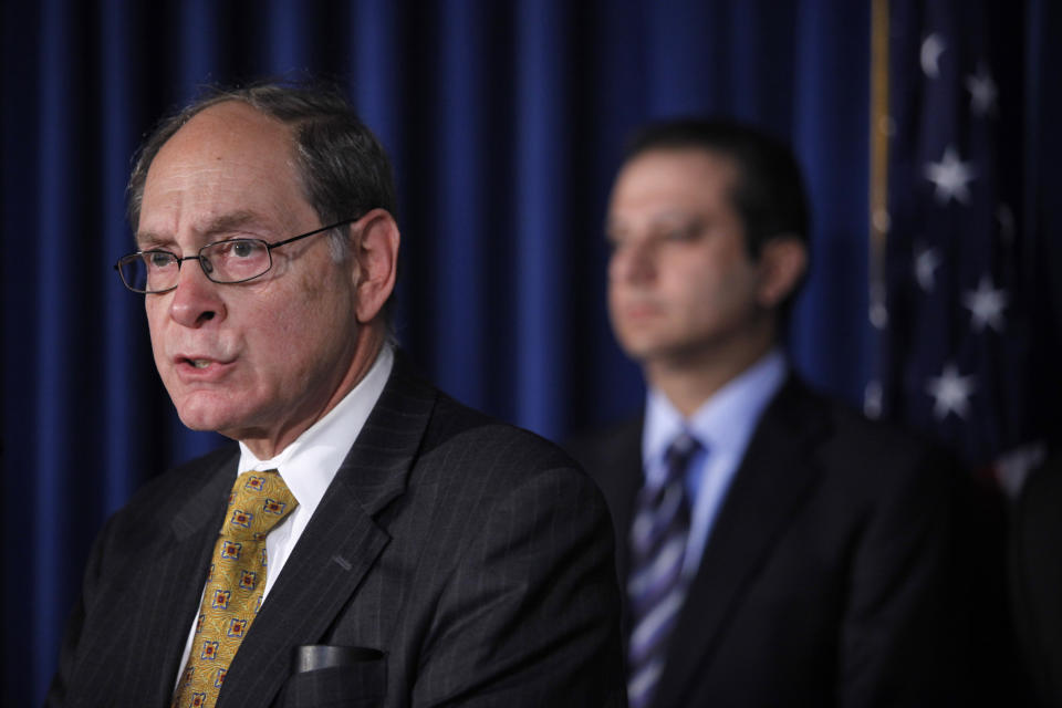 FILE - Securities Investor Protection Act Trustee Irving Picard, left, is joined by U.S. Attorney for the Southern District of New York Preet Bharara during a news conference, in New York, on Dec. 17, 2010. More than 12 years after Bernard Madoff confessed to running the biggest financial fraud in Wall Street history, a team of lawyers is still at work on a sprawling effort to recover money for the thousands of victims of his scam. Ongoing litigation by Picard and his chief counsel could potentially pull in billions of dollars more than already secured. (AP Photo/Mary Altaffer, File)