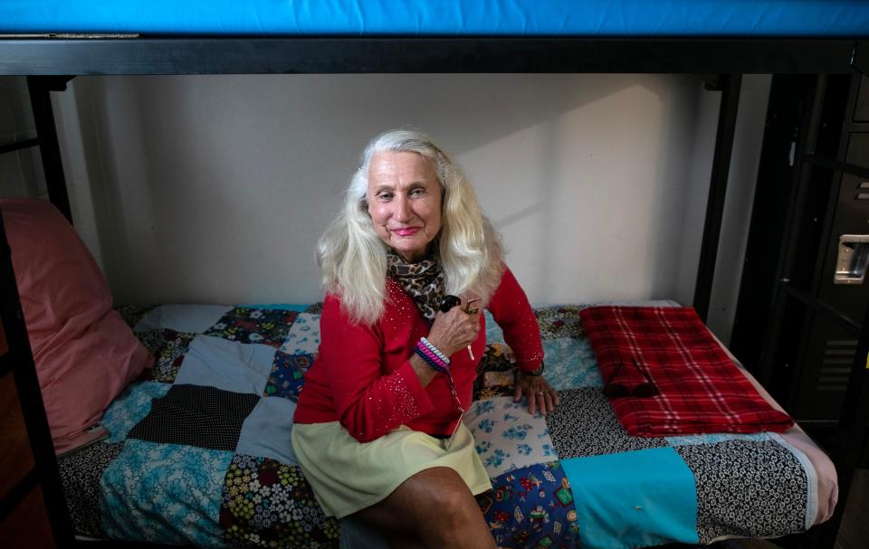 Nancy Kelly, 70, has lived at St. Matthew's House in Naples for the last few months while getting on her feet after the RV where she was living caught fire. She is pictured here in her shared bedroom.