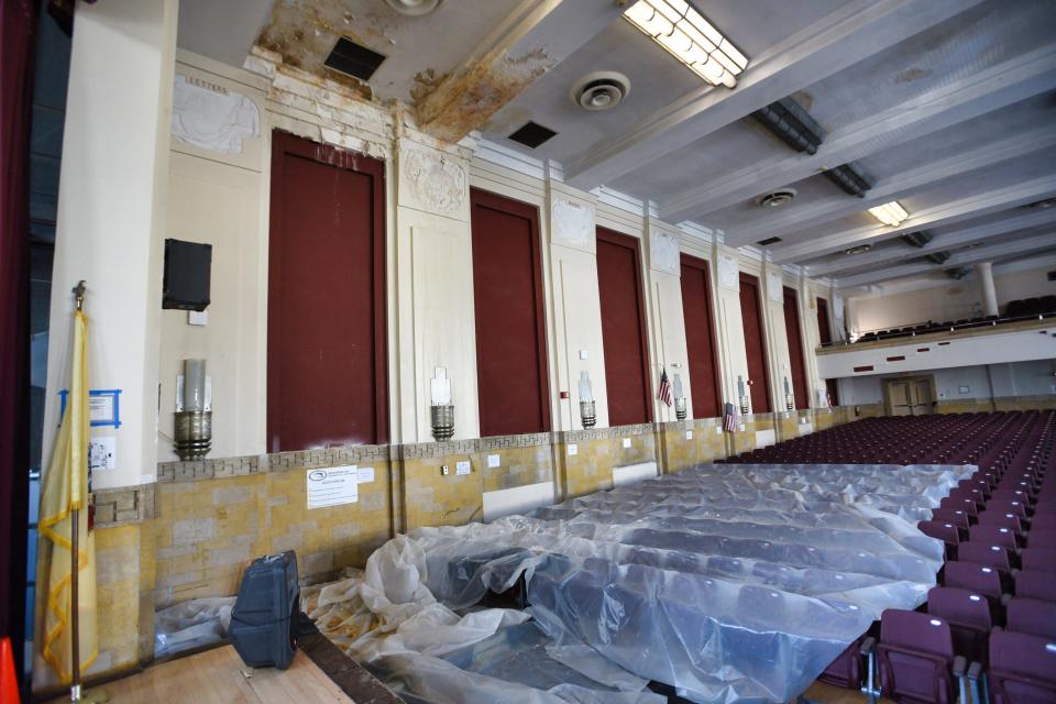 A leaking roof caused water damage on the walls and ceiling of the Art Deco style auditorium of Paterson's School 5.