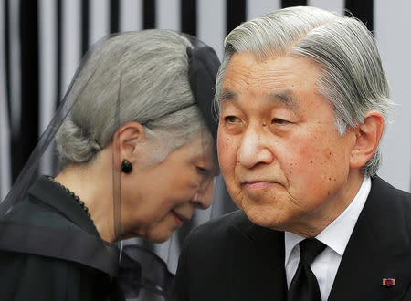 FILE PHOTO: Japan's Emperor Akihito (R) and Empress Michiko leave after praying at the altar of late Prince Tomohito, a cousin of the Emperor, in Tokyo June 19, 2012. REUTERS/Itsuo Inouye/Pool/File Photo