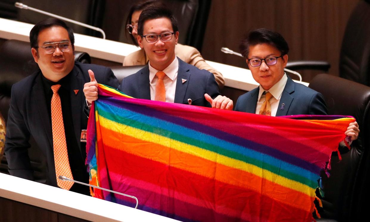 <span>Thai lawmakers inside parliament celebrate the passing of the marriage equality bill.</span><span>Photograph: Rungroj Yongrit/EPA</span>