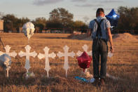 <p>Derrick Bernaden of San Antonio, Texas visits a memorial where 26 crosses stand in a field on the edge of town to honor the 26 victims killed at the First Baptist Church of Sutherland Springs on Nov. 7, 2017 in Sutherland Springs, Texas. (Photo: Scott Olson/Getty Images) </p>