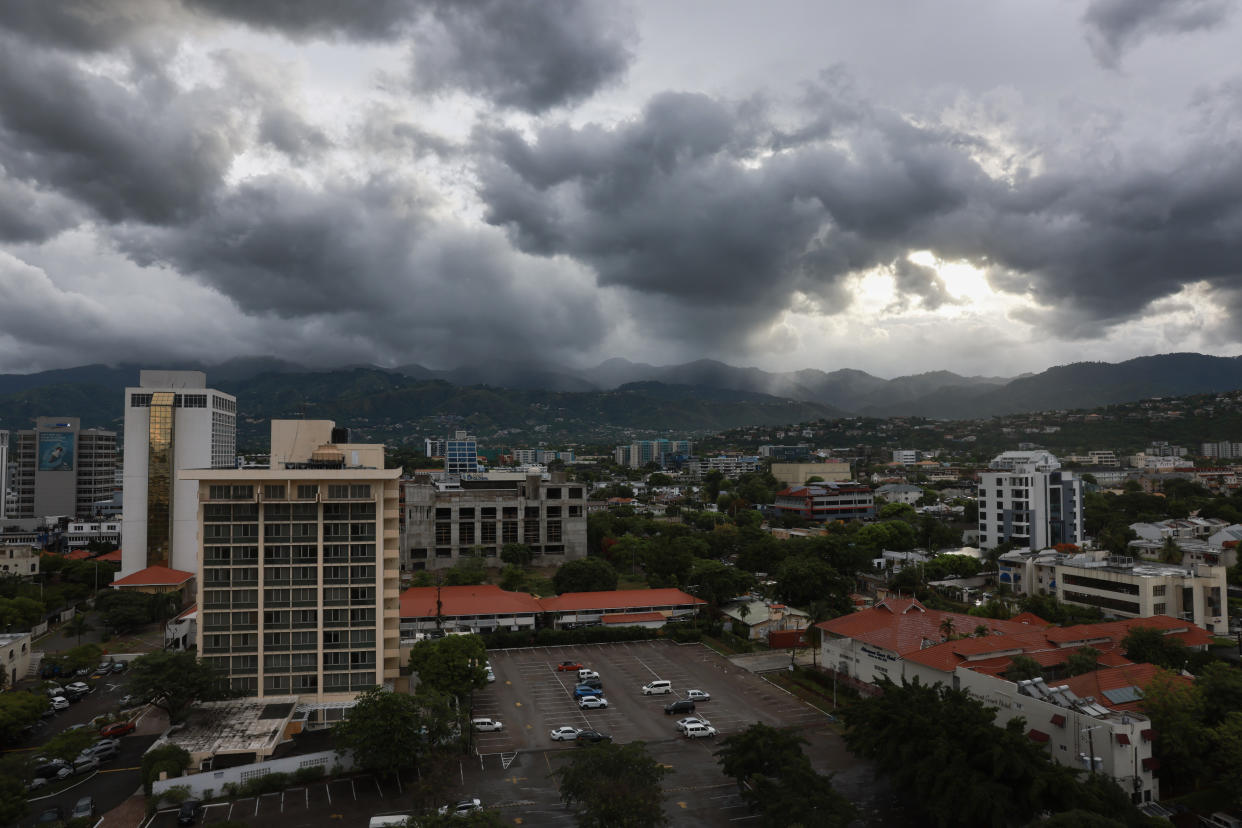 Storm clouds hover over the mountains ahead of Hurricane Beryl in Kingston Jamaica.