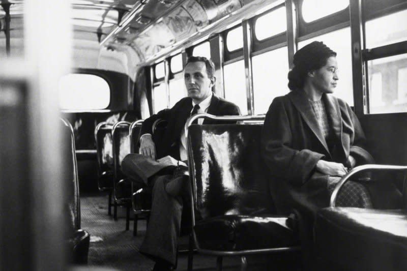 Rosa Parks sits up front of a Montgomery, Ala., bus with UPI reporter Nicholas Chriss in on December 21,1956, one year after she refused to give up her seat to a white man and was arrested. Parks died October 24, 2005. File Photo by UPI