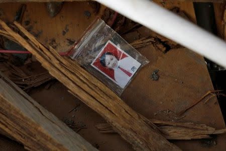 A picture is seen among the rubble of a destroyed house after an earthquake in the Balaroa neighbourhood in Palu, Central Sulawesi, Indonesia, October 7, 2018. REUTERS/Jorge Silva.