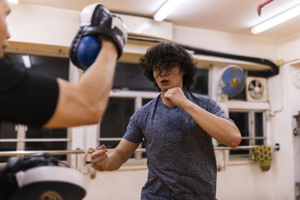 A practitioner trains during a Jeet Kune Do class in Hong Kong, Wednesday, July 19, 2023. (AP Photo/Louise Delmotte)