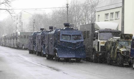 Special-purpose vehicles of law enforcement services are parked before a rally, denouncing the new tax on those not in full-time employment and marking the 99th anniversary of the proclamation of the Belarussian People's Republic, in Minsk, Belarus, March 25, 2017. REUTERS/Vasily Fedosenko