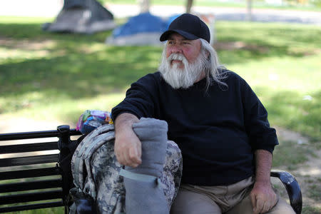 Fernando Ochoa, 65, who has been homeless for a week, sits on a park bench in Los Angeles, California, U.S. April 11, 2018. REUTERS/Lucy Nicholson