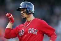 Boston Red Sox's Mookie Betts reacts after his RBI single during the third inning of a baseball game against the Baltimore Orioles in Boston, Sunday, Sept. 29, 2019. (AP Photo/Michael Dwyer)