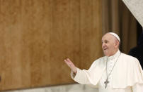 Pope Francis arrives to attend his weekly general audience in the Paul VI hall at the Vatican, Wednesday, Aug. 4, 2021. It was Francis' first general audience since undergoing planned surgery to remove half his colon for a severe narrowing of his large intestine on July 4, his first major surgery since he became pope in 2013. (AP Photo/Riccardo De Luca)