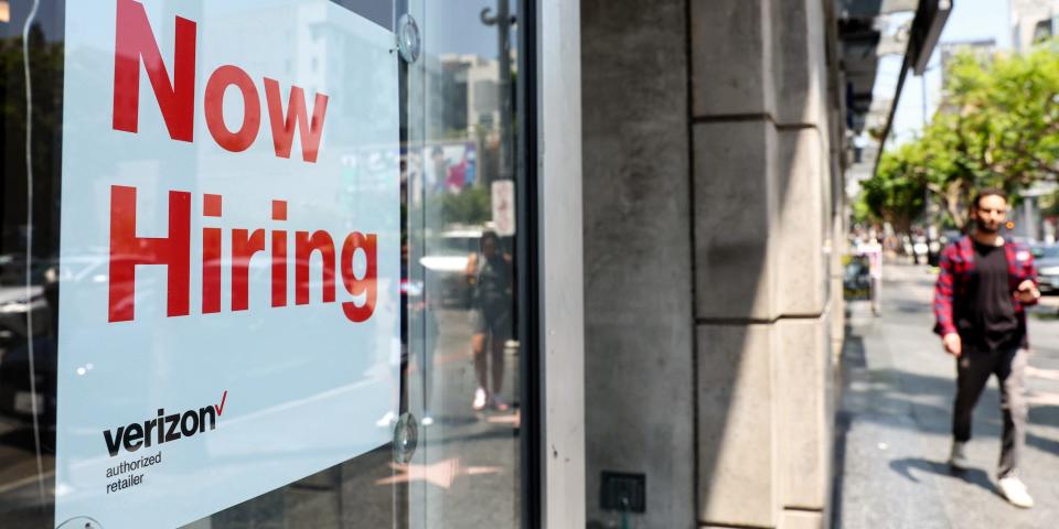 A hiring sign at a store