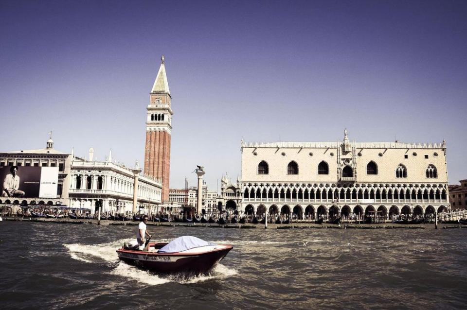 Venice from the water with a boat in the foreground 