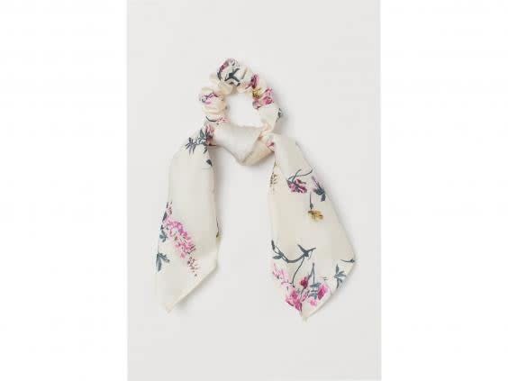 This floral scrunchie reminds us of lush meadows and country walks (H&M)