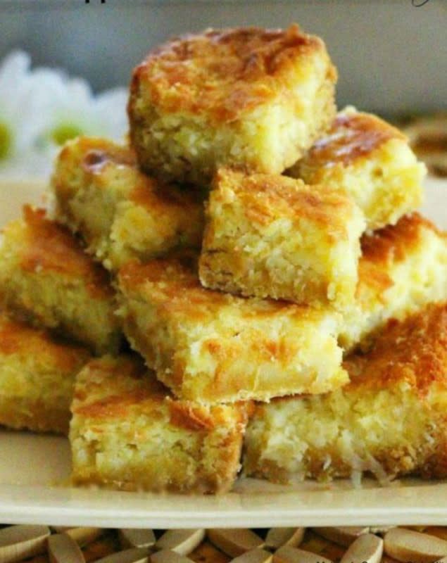 <p><strong>Pineapple Coconut Chess Bars</strong><br> Get the recipe<a href="https://www.melissassouthernstylekitchen.com/pineapple-coconut-chess-bars/" rel="nofollow noopener" target="_blank" data-ylk="slk:here;elm:context_link;itc:0;sec:content-canvas" class="link "><em><strong> here</strong></em></a></p>