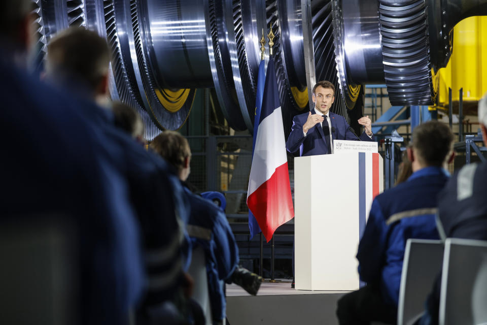 French President Emmanuel Macron delivers a speech at the GE Steam Power System main production site for its nuclear turbine systems in Belfort, eastern France, Thursday, Feb. 10, 2022. French President Emmanuel Macron unveiled plans to build new nuclear reactors in the country as part of its energy strategy to reduce planet-warming emissions. (AP Photo/Jean-Francois Badias, Pool)