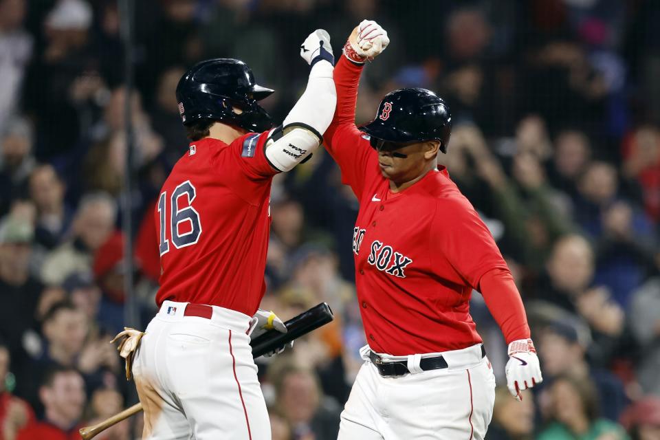 Boston Red Sox's Rafael Devers, right, celebrates after his two-run home run with Jarren Duran (16) during the eighth inning of a baseball game against the Toronto Blue Jays, Thursday, May 4, 2023, in Boston. (AP Photo/Michael Dwyer)