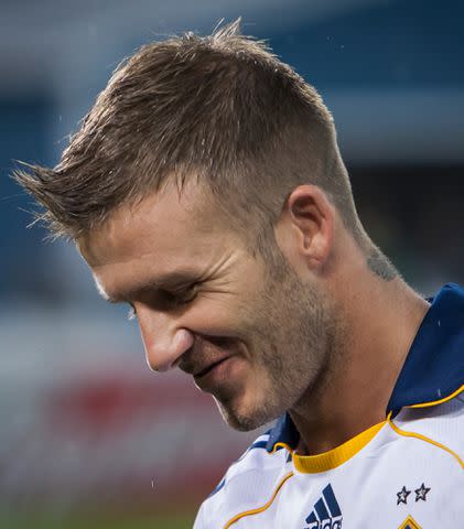 Ira L. Black/Corbis David Beckham smiles as he drinks water at the start of the Major League Soccer match between LA Galaxy and DC United.