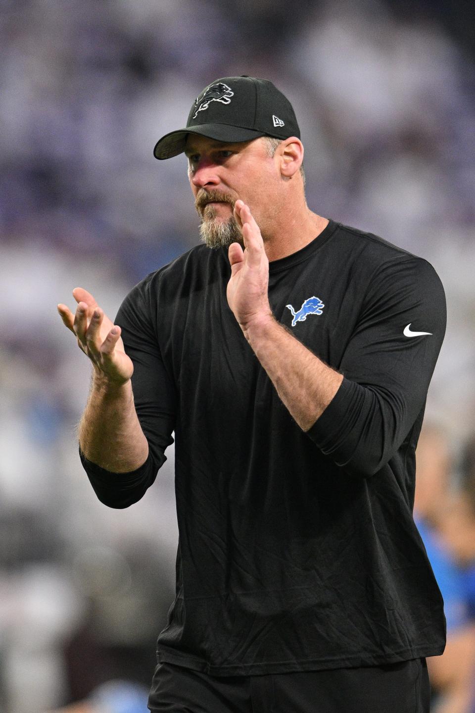 Detroit Lions head coach Dan Campbell claps before the game against the Minnesota Vikings at U.S. Bank Stadium in Minneapolis, Dec. 24, 2023.