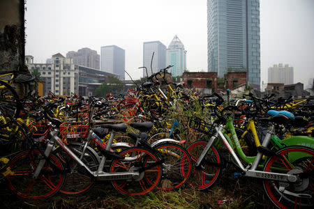 FILE PHOTO: Bicycles of various bike-sharing services are seen in Shanghai, China, November 21, 2017. REUTERS/Aly Song