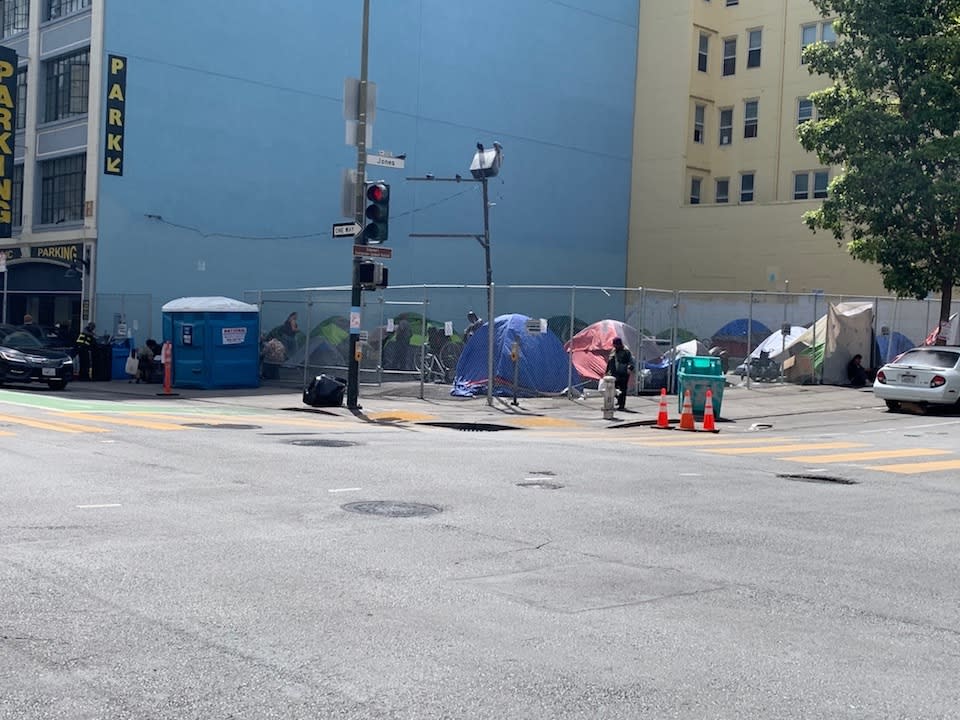 The tent count at 180 Jones St. today was more than double the number of residents the city had expected. The site remains surrounded by more tents on the sidewalks.