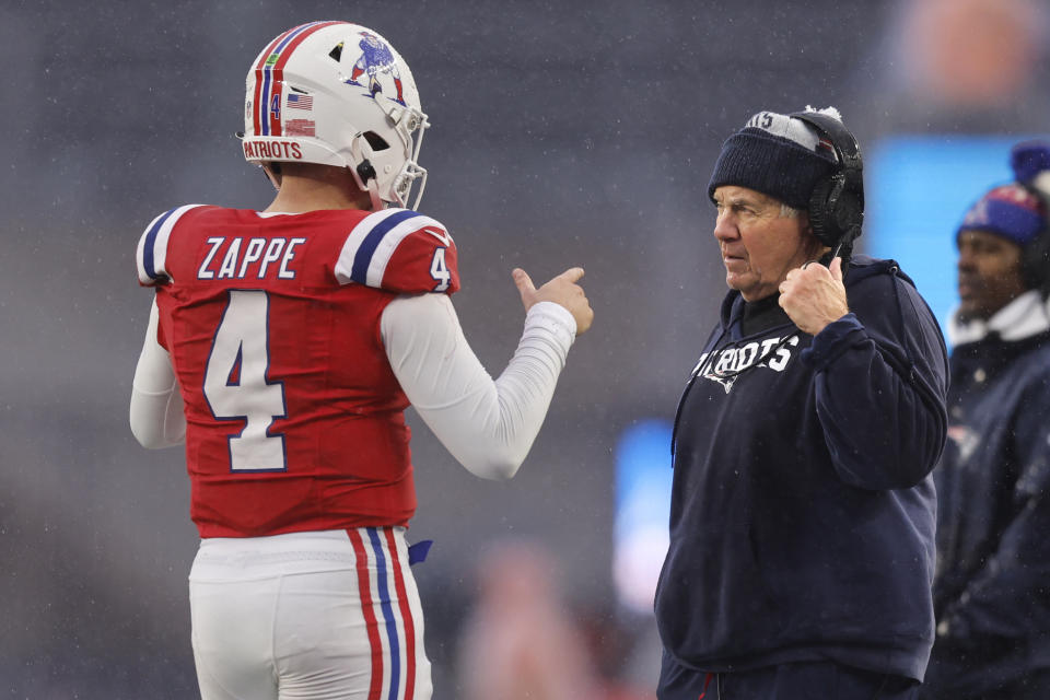 New England Patriots head coach Bill Belichick, right, talks with quarterback Bailey Zappe (4) during the second half of an NFL football game against the Los Angeles Chargers, Sunday, Dec. 3, 2023, in Foxborough, Mass. (AP Photo/Michael Dwyer)