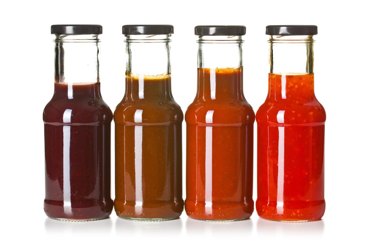 Assorted barbecue sauces in glass jars