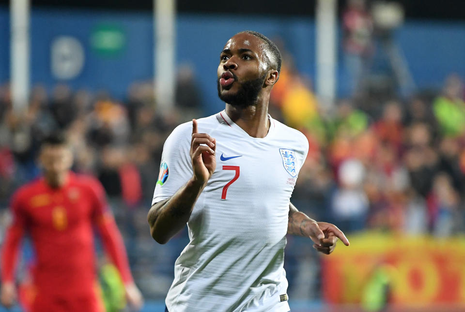 Sterling celebrates after scoring his team's fifth against Montenegro, following racist abuse. (Credit: Getty Images)