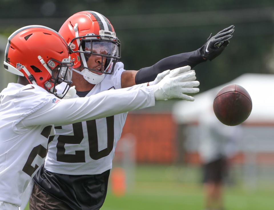 Cleveland Browns cornerback Greg Newsome III breaks up a pass during training camp drills on Thursday, July 28, 2022 in Berea.