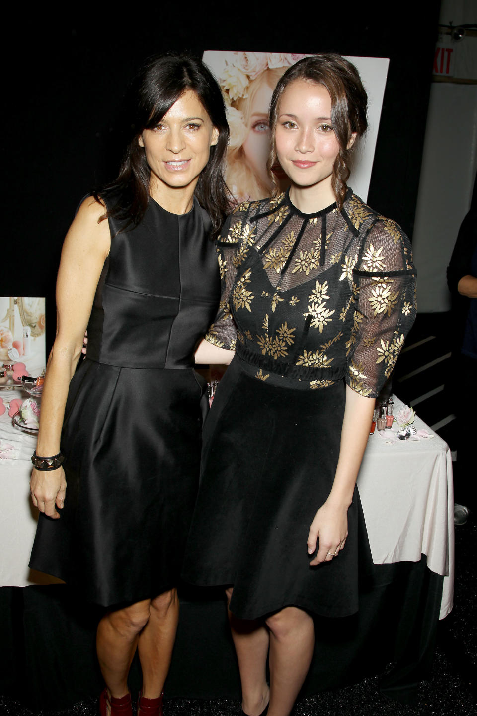 This image released by Starpix shows actresses Perrey Reeves, left, and Katie Chang attending the Jill Stuart Spring 2014 show during Fashion Week in New York, Saturday, Sept. 7, 2013. (AP Photo/Starpix, Marion Curtis)