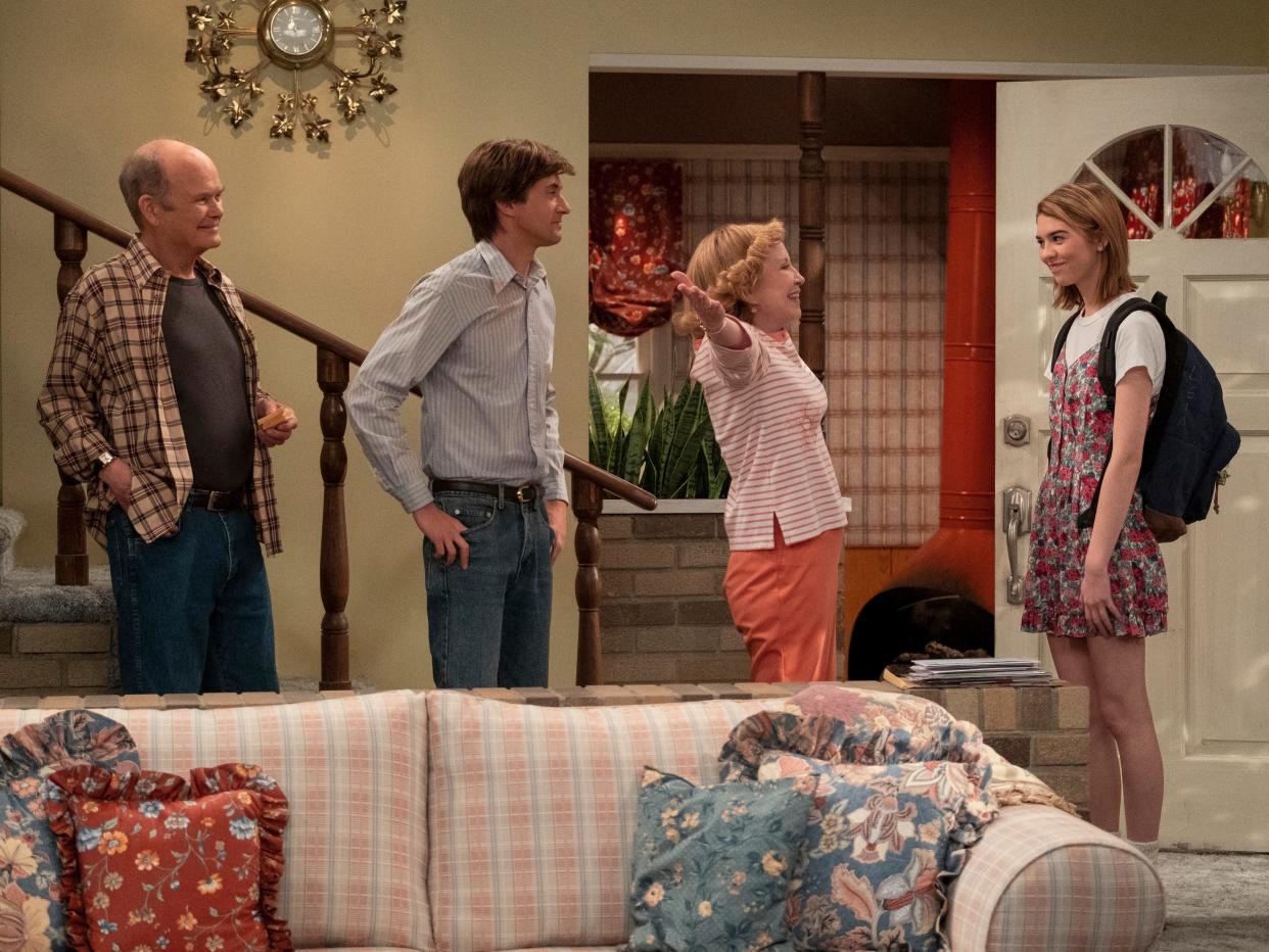 (L to R): Kurtwood Smith as Red Forman, Topher Grace as Eric Forman, Debra Jo Rupp as Kitty Forman, Callie Haverda as Leia Forman on season one, episode one of "That ‘90s Show."