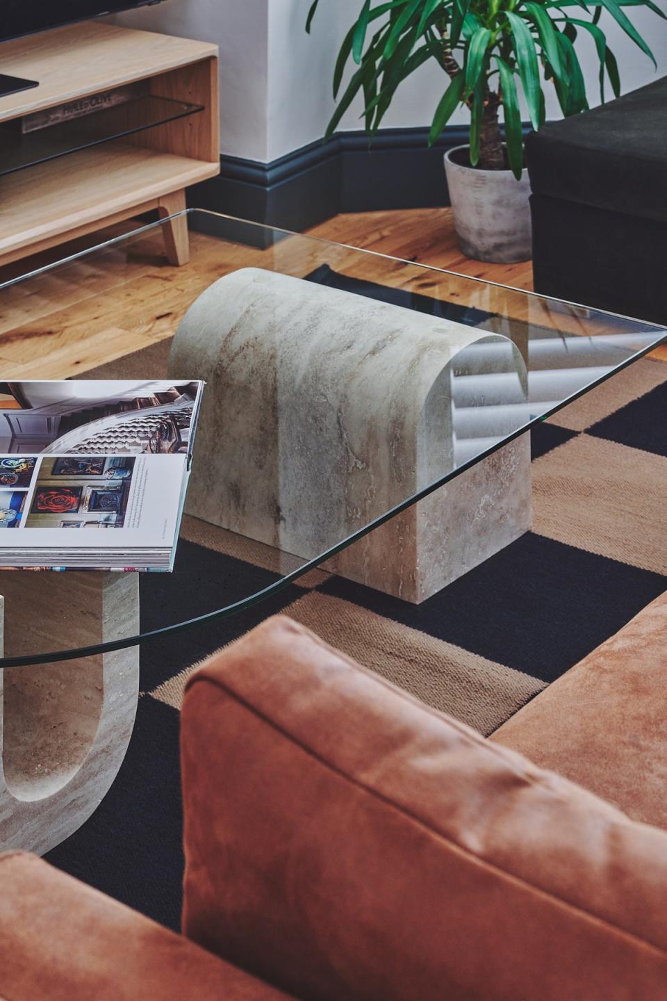 To make spaces feel larger, opt for glass furniture so you can see around and through items (Topology)