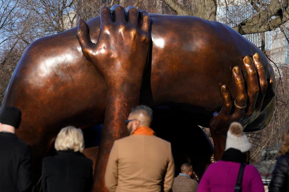 A 20-foot-high bronze sculpture ‘The Embrace,’ a memorial to Dr. Martin Luther King Jr. and Coretta King, has been derided online (Associated Press)