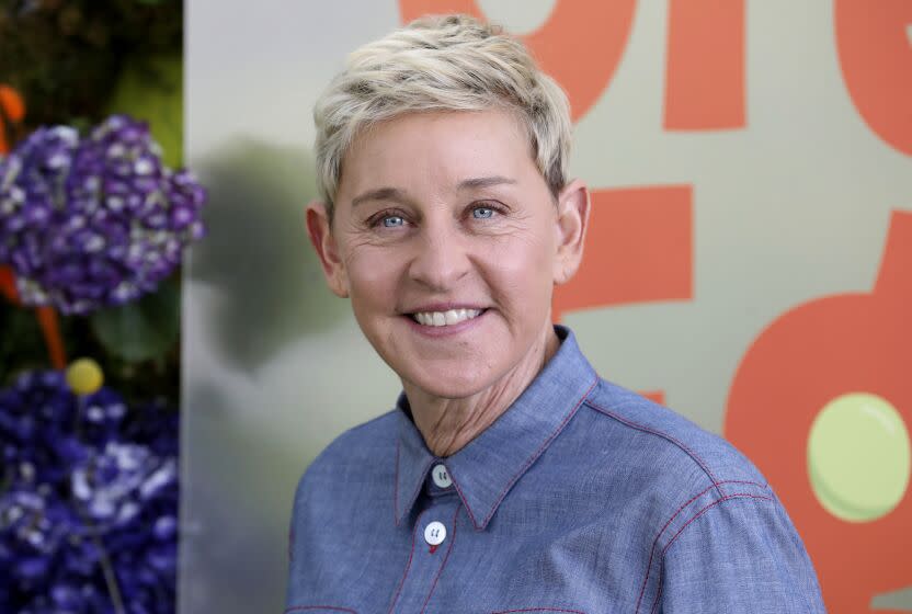 Ellen DeGeneres in a blue button up shirt