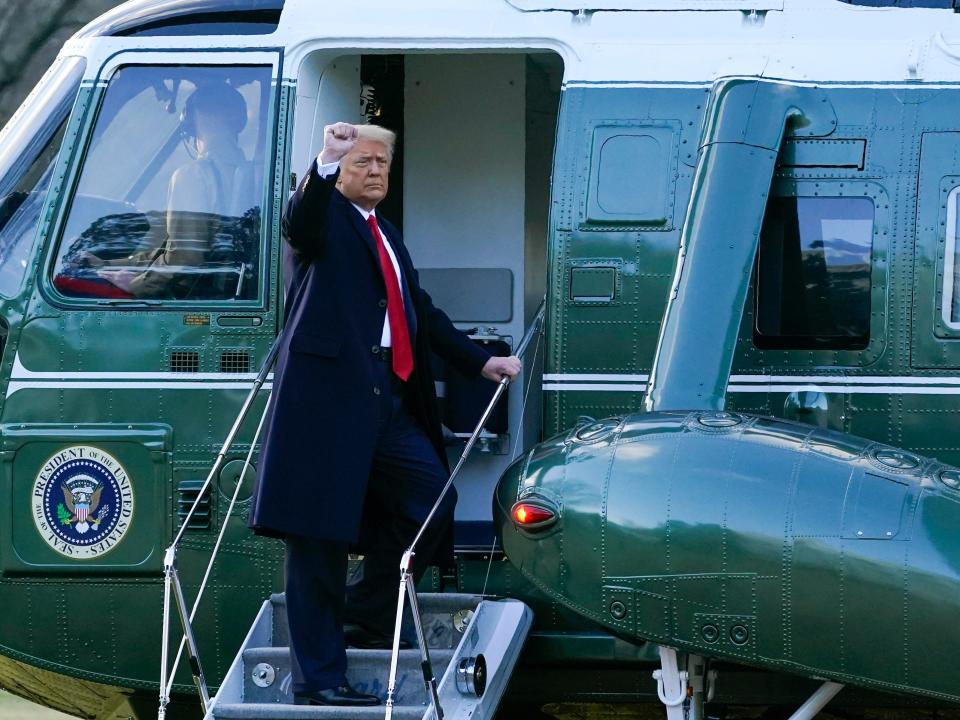 President Donald Trump gestures as he boards Marine One on the South Lawn of the White House, Wednesday, Jan. 20, 2021, in Washington. Trump is en route to his Mar-a-Lago Florida Resort.