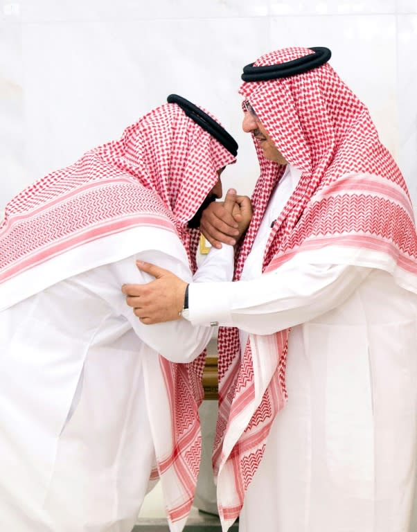 Saudi Arabia's former Crown Prince and Interior Minister Mohammed bin Nayef (R) pledges his allegiance to his successor newly appointed Crown Prince Mohammed bin Salman, at the Royal Palace in Mecca