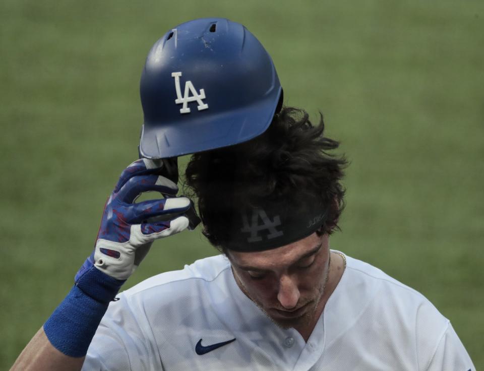 Dodgers center fielder Cody Bellinger walks back to the dugout after flying out during Game 2.